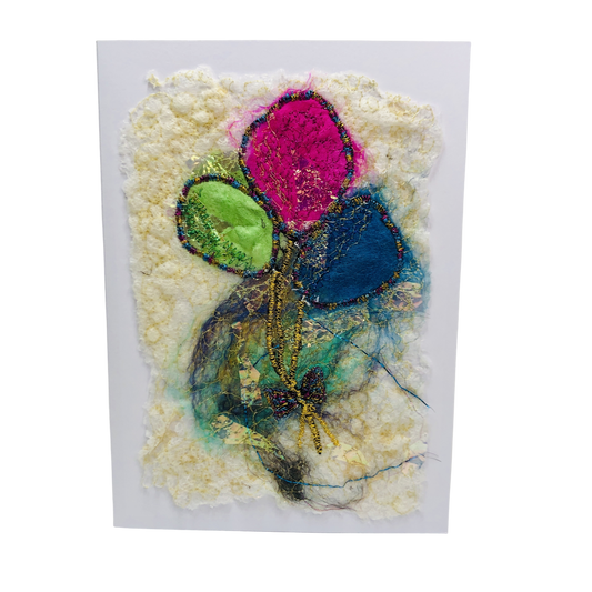 Carte de vœux avec jolis ballons verts, roses et bleus brodée sur la laine